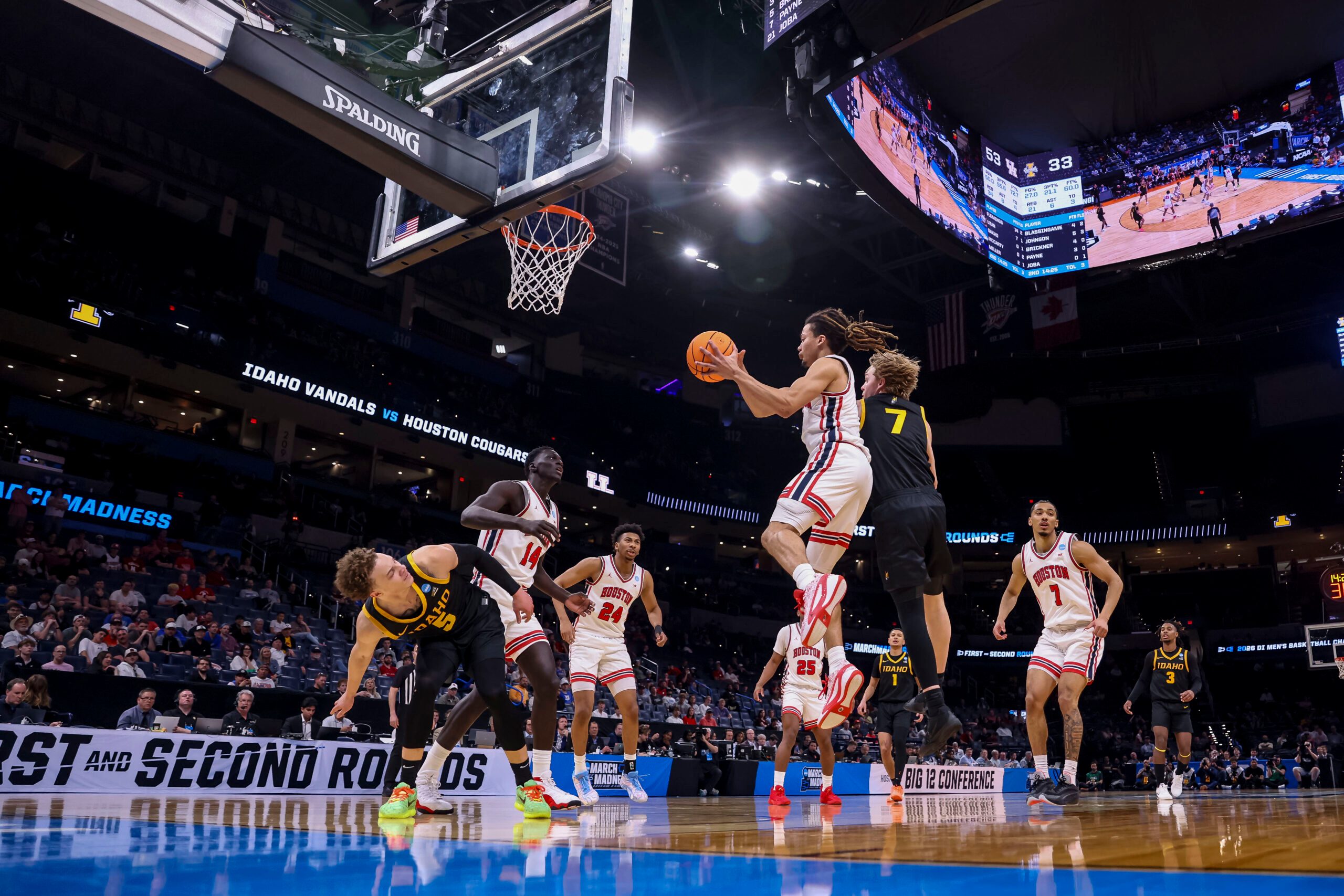 Mar 19, 2026; Oklahoma City, OK, USA; Houston Cougars guard Kingston Flemings (4) attempts a layup during a first round game of the men's 2026 NCAA Tournament at Paycom Center. Mandatory Credit: William Purnell-Imagn Images
