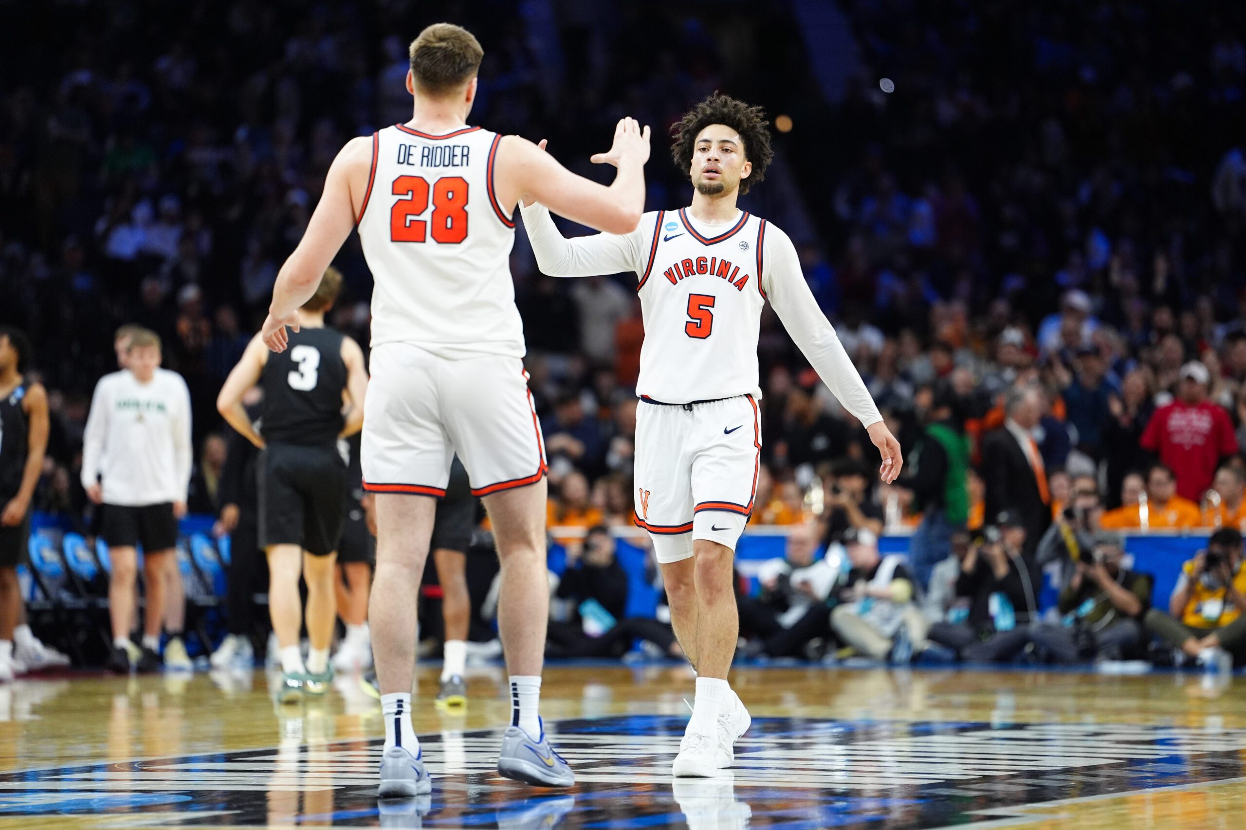Mar 20, 2026; Philadelphia, PA, USA; Virginia Cavaliers guard Sam Lewis (5) and Virginia Cavaliers forward Thijs de Ridder (28) celebrate after the game against the Wright State Raiders during a first round game of the men's 2026 NCAA Tournament at Xfinity Mobile Arena. Mandatory Credit: Kyle Ross-Imagn Images