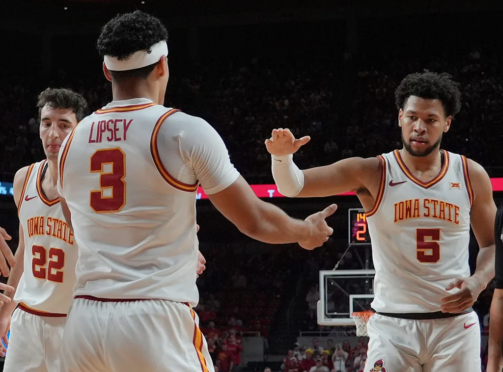 Iowa State Cyclones guard Tamin Lipsey (3)celebrates with forward Joshua Jefferson (5) and forward Milan Momcilovic (22) after a three-point play during the second half on Jan. 2, 2026, at Hilton Coliseum in Ames, Iowa.