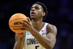 Mar 20, 2026; Philadelphia, PA, USA; UConn Huskies forward Tarris Reed Jr. (5) shoots a free throw in the first half during a first round game of the men's 2026 NCAA Tournament at Xfinity Mobile Arena. Mandatory Credit: Bill Streicher-Imagn Images