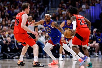 Mar 20, 2026; Denver, Colorado, USA; Toronto Raptors guard Jamal Shead (23) controls the ball as Denver Nuggets guard Bruce Brown (11) and center Jakob Poeltl (19) battle for position in the third quarter at Ball Arena. Mandatory Credit: Isaiah J. Downing-Imagn Images
