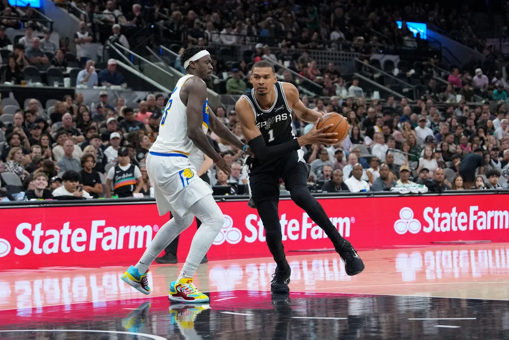 Mar 21, 2026; San Antonio, Texas, USA; San Antonio Spurs forward Victor Wembanyama (1) dribbles against Indiana Pacers forward Pascal Siakam (43) in the second half at Frost Bank Center. Mandatory Credit: Daniel Dunn-Imagn Images
