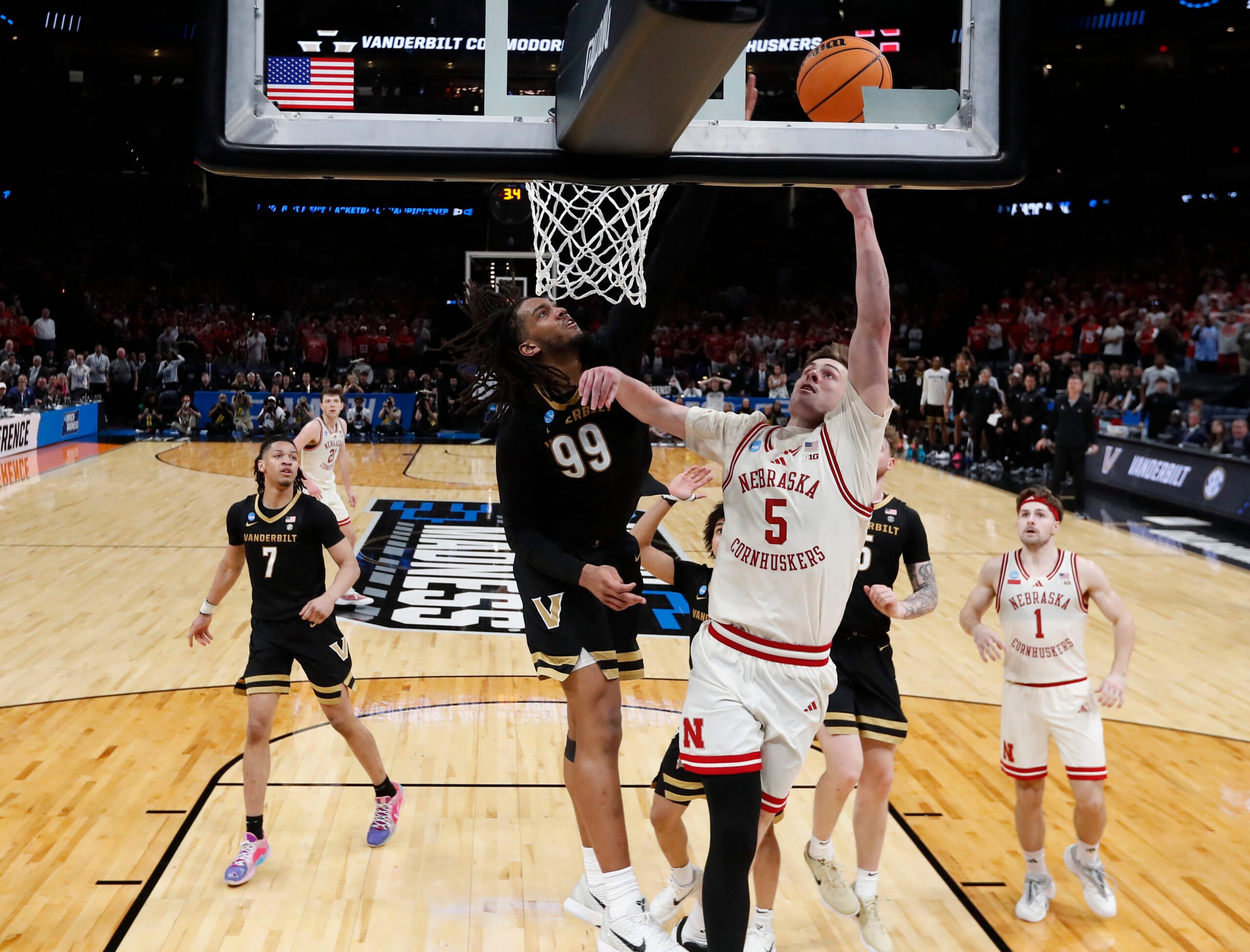 Mar 21, 2026; Oklahoma City, OK, USA; Nebraska Cornhuskers forward Braden Frager (5) drives to the hoop past Vanderbilt Commodores forward Devin McGlockton (99) during the second half of a second round game of the men's 2026 NCAA Tournament at Paycom Center. Mandatory Credit: Alonzo Adams-Imagn Images