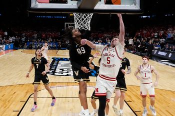 Mar 21, 2026; Oklahoma City, OK, USA; Nebraska Cornhuskers forward Braden Frager (5) drives to the hoop past Vanderbilt Commodores forward Devin McGlockton (99) during the second half of a second round game of the men's 2026 NCAA Tournament at Paycom Center. Mandatory Credit: Alonzo Adams-Imagn Images