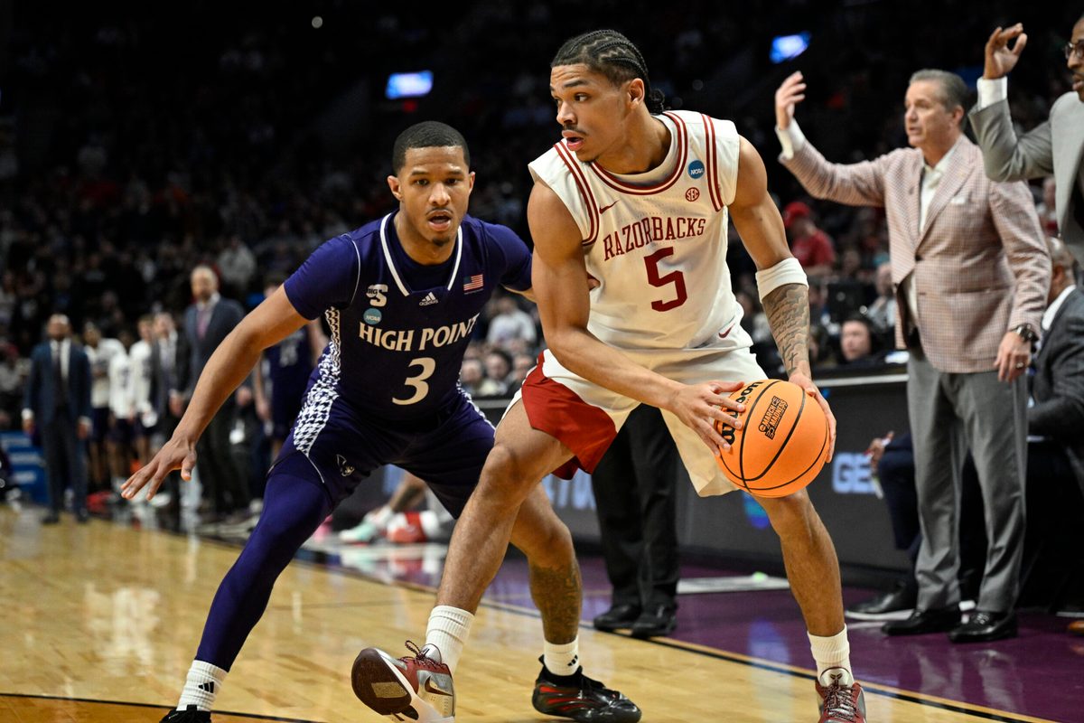 Mar 21, 2026; Portland, OR, USA; Arkansas Razorbacks guard Darius Acuff Jr. (5) drives against High Point Panthers guard Rob Martin (3) in the second half during a second round game of the men's 2026 NCAA Tournament at Moda Center. Mandatory Credit: Troy Wayrynen-Imagn Images