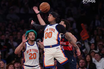 Mar 22, 2026; New York, New York, USA; New York Knicks guard Jordan Clarkson (00) tosses a no-look pass to forward Jeremy Sochan (20) during the second half against the Washington Wizards at Madison Square Garden. Mandatory Credit: Vincent Carchietta-Imagn Images