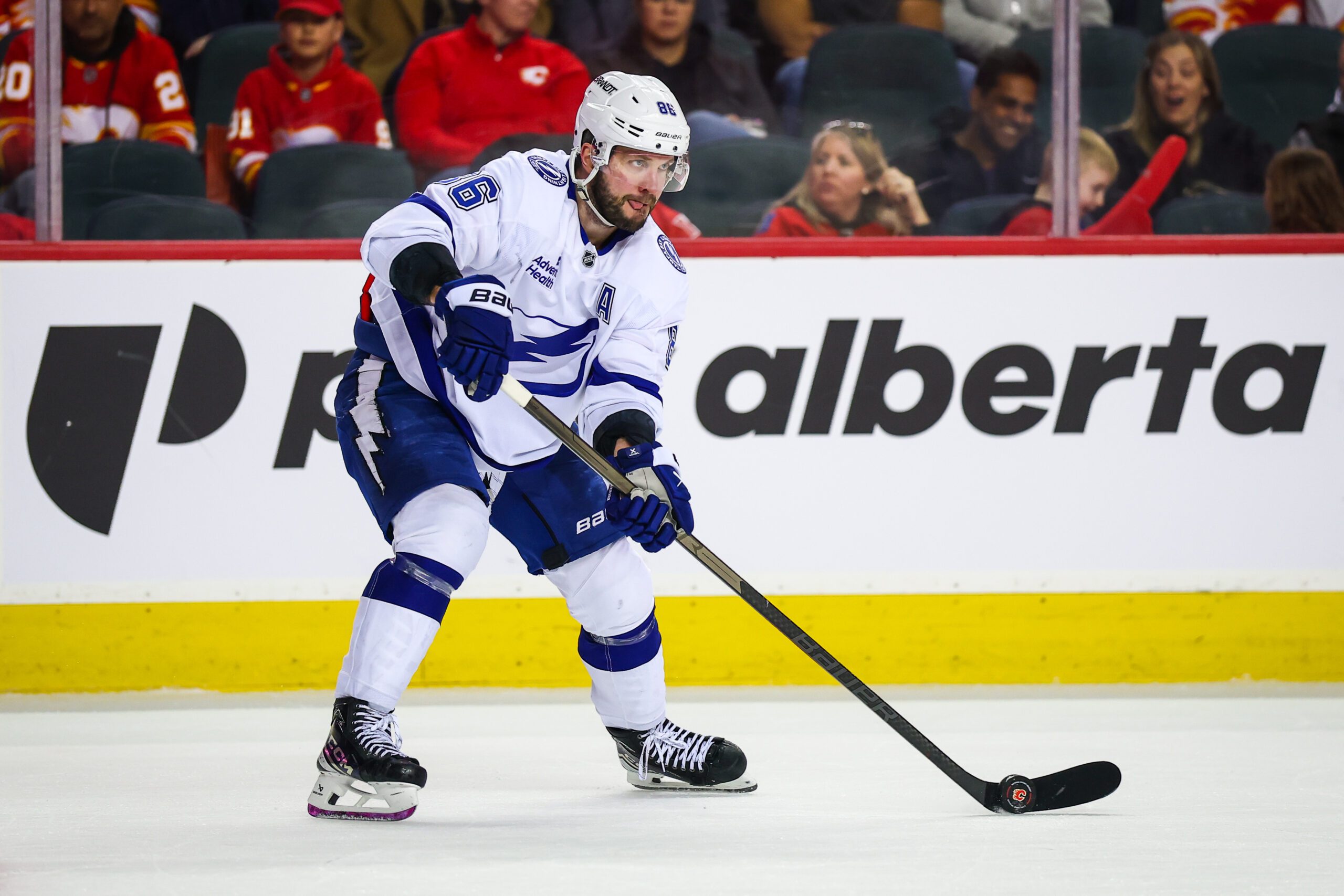 Mar 22, 2026; Calgary, Alberta, CAN; Tampa Bay Lightning right wing Nikita Kucherov (86) skates with the puck against the Calgary Flames during the third period at Scotiabank Saddledome. Mandatory Credit: Sergei Belski-Imagn Images