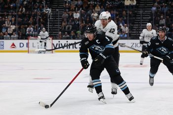 Mar 22, 2026; Salt Lake City, Utah, USA; Utah Mammoth right wing Clayton Keller (9) skates with the puck against Los Angeles Kings left wing Trevor Moore (12) during the third period at Delta Center. Mandatory Credit: Rob Gray-Imagn Images