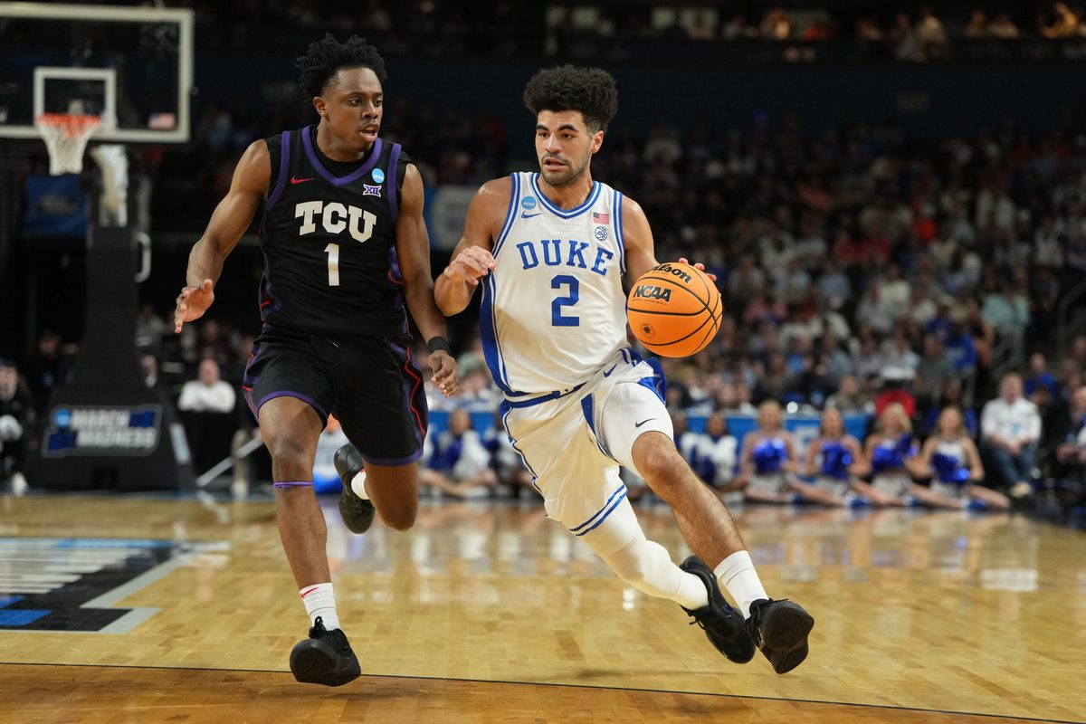 Mar 21, 2026; Greenville, SC, USA;  Duke Blue Devils guard Cayden Boozer (2) with the ball as Texas Christian University Horned Frogs guard Jayden Pierre (1) defends in the first half during a second round game of the men's 2026 NCAA Tournament at Bon Secours Wellness Arena. Mandatory Credit: Bob Donnan-Imagn Images