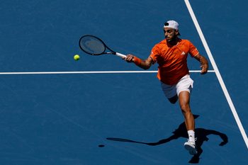 Mar 23, 2026; Miami Gardens, FL, USA; Francisco Cerundolo (ARG) hits a forehand against Daniil Medvedev (not pictured) on day 7 of the 2026 Miami Open at Hard Rock Stadium. Mandatory Credit: Geoff Burke-Imagn Images