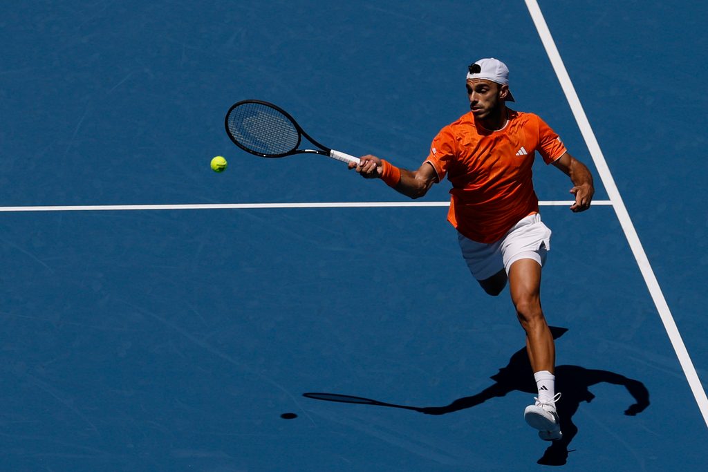 Mar 23, 2026; Miami Gardens, FL, USA; Francisco Cerundolo (ARG) hits a forehand against Daniil Medvedev (not pictured) on day 7 of the 2026 Miami Open at Hard Rock Stadium. Mandatory Credit: Geoff Burke-Imagn Images