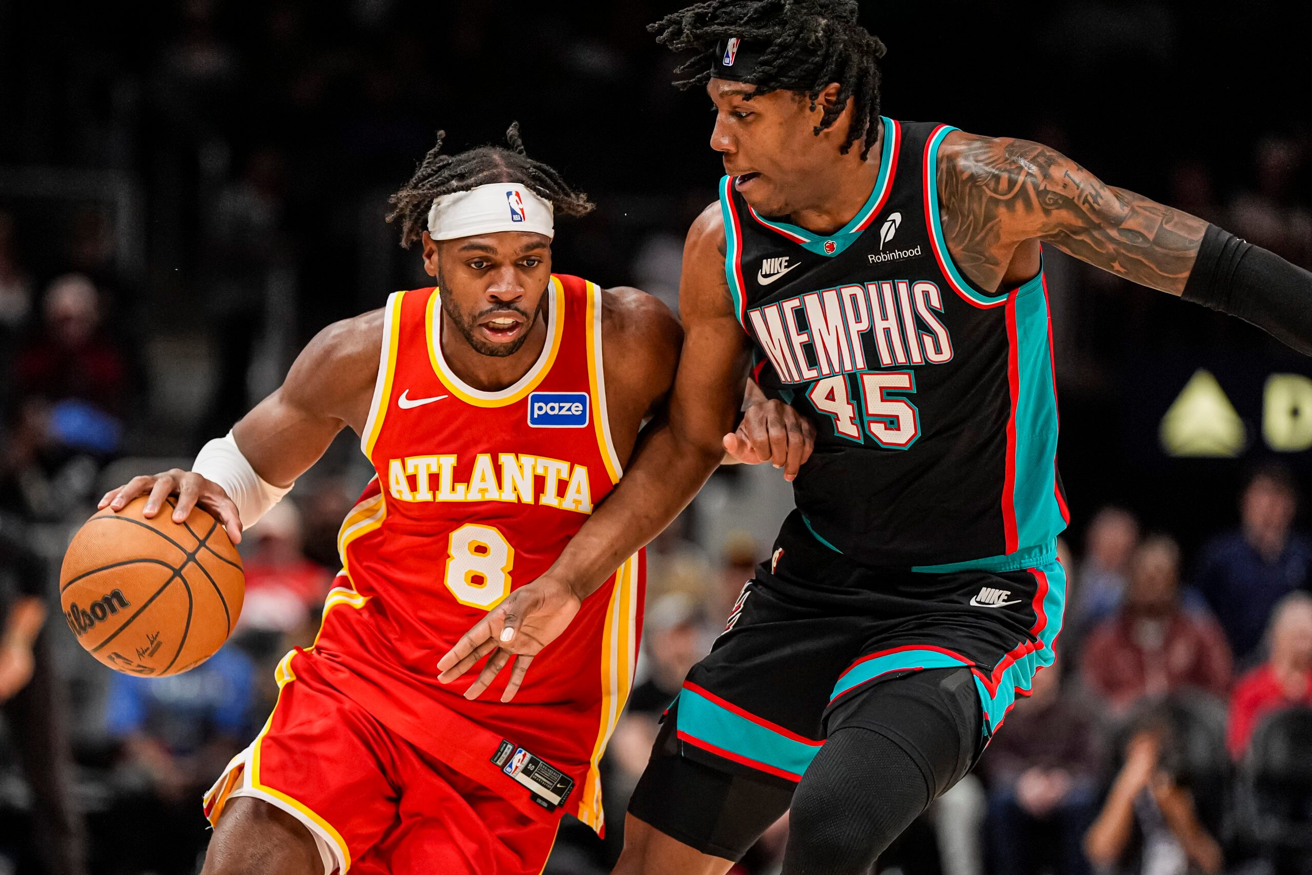 Mar 23, 2026; Atlanta, Georgia, USA; Atlanta Hawks guard Buddy Hield (8) dribbles against Memphis Grizzlies forward GG Jackson (45) during the second half at State Farm Arena. Mandatory Credit: Dale Zanine-Imagn Images