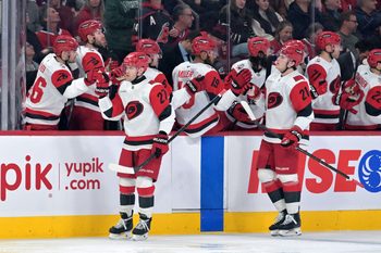 Mar 24, 2026; Montreal, Quebec, CAN; Carolina Hurricanes forward Nikolaj Ehlers (27) celebrates with teammates after scoring a goal against the Montreal Canadiens during the first period at the Bell Centre. Mandatory Credit: Eric Bolte-Imagn Images