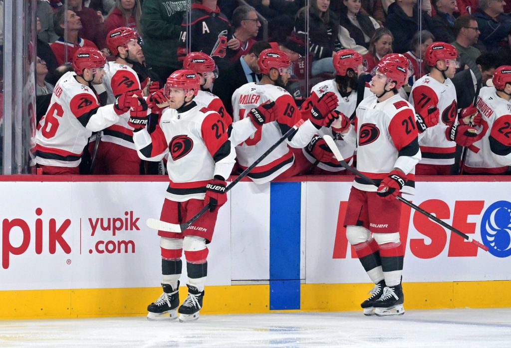 Mar 24, 2026; Montreal, Quebec, CAN; Carolina Hurricanes forward Nikolaj Ehlers (27) celebrates with teammates after scoring a goal against the Montreal Canadiens during the first period at the Bell Centre. Mandatory Credit: Eric Bolte-Imagn Images