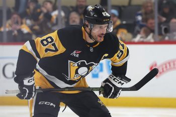 Mar 24, 2026; Pittsburgh, Pennsylvania, USA;  Pittsburgh Penguins center Sidney Crosby (87) prepares to take the opening face-off against the Colorado Avalanche during the first period at PPG Paints Arena. Mandatory Credit: Charles LeClaire-Imagn Images
