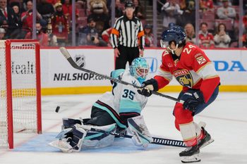 Mar 24, 2026; Sunrise, Florida, USA; Florida Panthers center Vinnie Hinostroza (24) scores the winning goal against Seattle Kraken goaltender Joey Daccord (35) during a shootout at Amerant Bank Arena. Mandatory Credit: Sam Navarro-Imagn Images
