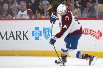 Mar 24, 2026; Pittsburgh, Pennsylvania, USA;  Colorado Avalanche center Nazem Kadri (91) shoots the puck against the Pittsburgh Penguins during the third period at PPG Paints Arena. Mandatory Credit: Charles LeClaire-Imagn Images