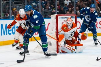 Mar 24, 2026; Vancouver, British Columbia, CAN; Anaheim Ducks goalie Lukas Dostal (1) watches Vancouver Canucks forward Evander Kane (91) handle the puck in the second period at Rogers Arena. Mandatory Credit: Bob Frid-Imagn Images