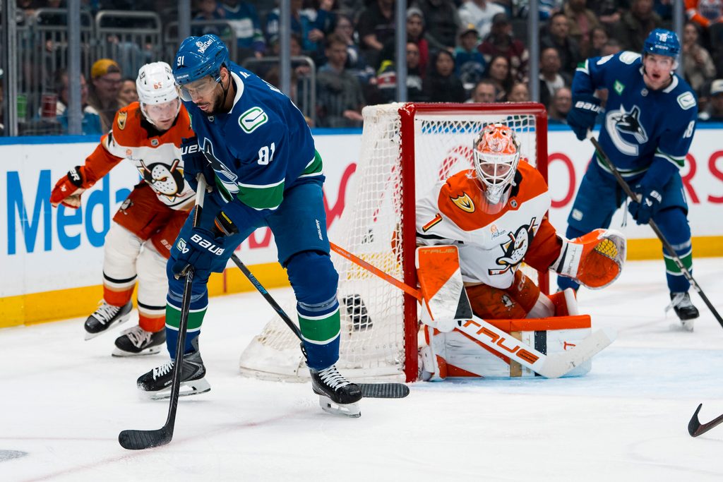 Mar 24, 2026; Vancouver, British Columbia, CAN; Anaheim Ducks goalie Lukas Dostal (1) watches Vancouver Canucks forward Evander Kane (91) handle the puck in the second period at Rogers Arena. Mandatory Credit: Bob Frid-Imagn Images