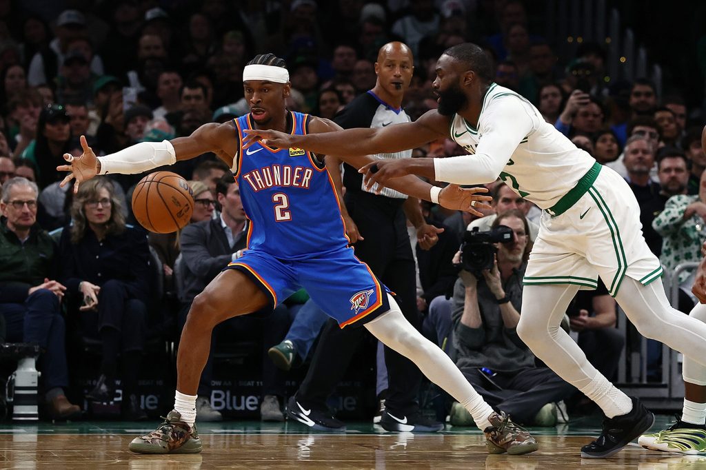 Mar 25, 2026; Boston, Massachusetts, USA; Oklahoma City Thunder guard Shai Gilgeous-Alexander (2) and Boston Celtics guard Jaylen Brown (7) eye a loose ball during the second quarter at TD Garden. Mandatory Credit: Winslow Townson-Imagn Images