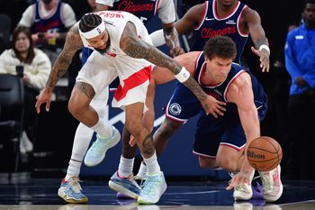 Mar 25, 2026; Inglewood, California, USA; Toronto Raptors forward Brandon Ingram (3) plays for the ball against Los Angeles Clippers center Brook Lopez (11) during the second half at Intuit Dome. Mandatory Credit: Gary A. Vasquez-Imagn Images