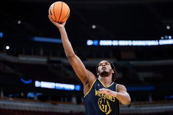 Mar 26, 2026; Chicago, IL, USA; Michigan Wolverines forward Morez Johnson Jr. (21) goes to the basket during a practice session ahead of the Midwest regional of the men's 2026 NCAA Tournament at United Center. Mandatory Credit: Kamil Krzaczynski-Imagn Images