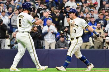Mar 26, 2026; Milwaukee, Wisconsin, USA; Milwaukee Brewers right fielder Sal Frelick (10) is greeted by left fielder Jake Bauers (9) after hitting a two-run home run in the fifth inning at American Family Field. Mandatory Credit: Benny Sieu-Imagn Images