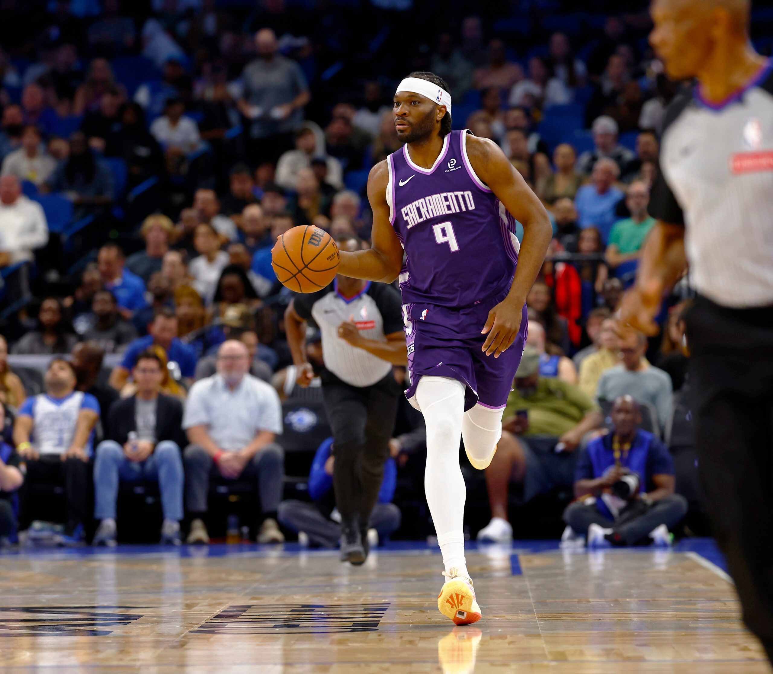 Mar 26, 2026; Orlando, Florida, USA;  Sacramento Kings center Precious Achiuwa (9) dribbles up the court in the first half against the Orlando Magic at Kia Center. Mandatory Credit: Russell Lansford-Imagn Images