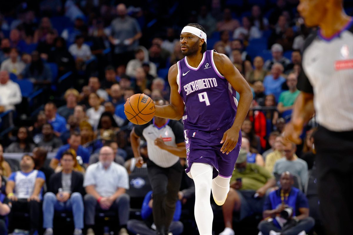 Mar 26, 2026; Orlando, Florida, USA; Sacramento Kings center Precious Achiuwa (9) dribbles up the court in the first half against the Orlando Magic at Kia Center. Mandatory Credit: Russell Lansford-Imagn Images