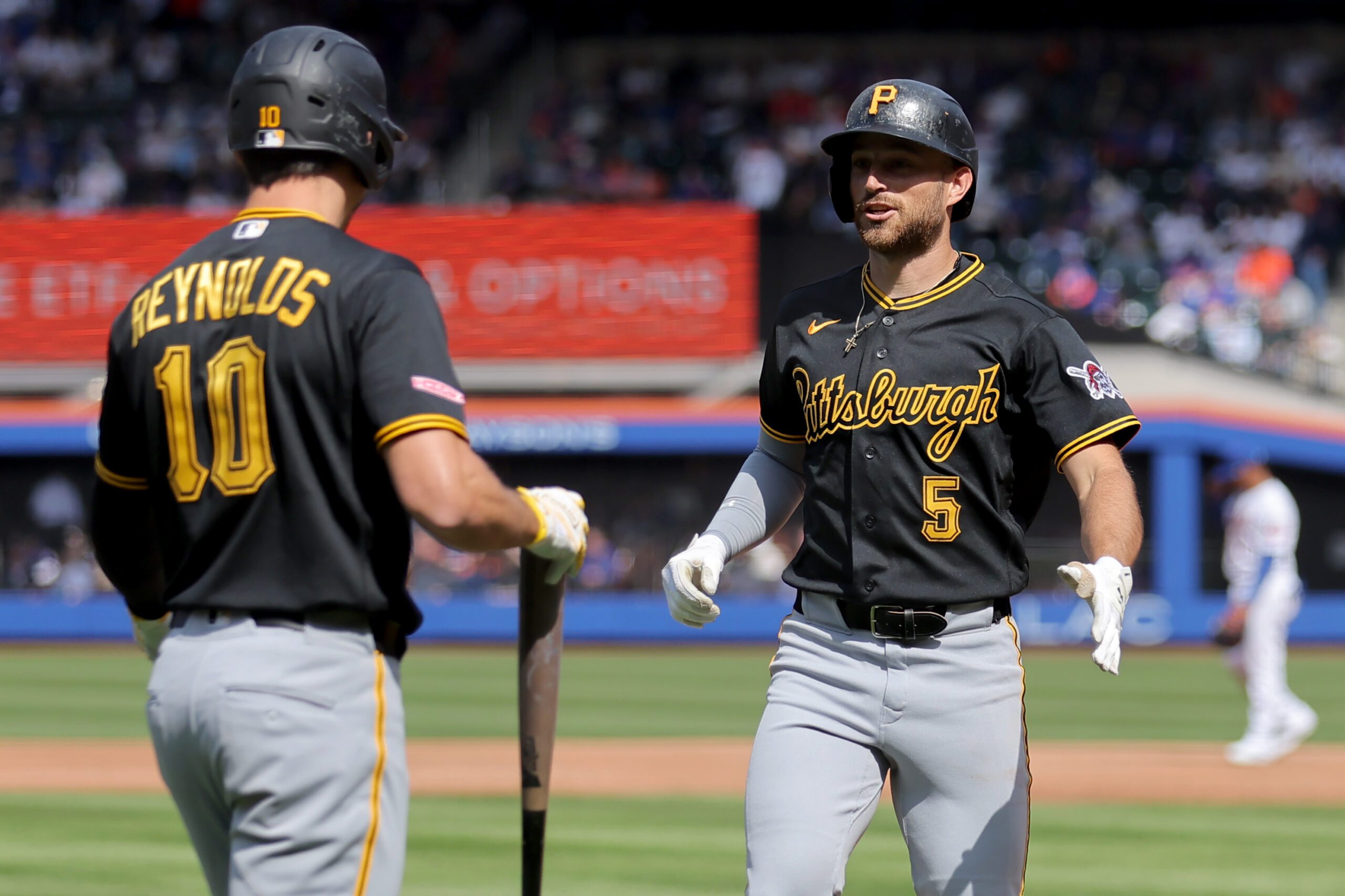 Mar 26, 2026; New York City, New York, USA; Pittsburgh Pirates second baseman Brandon Lowe (5) celebrates his solo home run against the New York Mets with left fielder Bryan Reynolds (10) during the third inning at Citi Field. Mandatory Credit: Brad Penner-Imagn Images