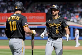 Mar 26, 2026; New York City, New York, USA; Pittsburgh Pirates second baseman Brandon Lowe (5) celebrates his solo home run against the New York Mets with left fielder Bryan Reynolds (10) during the third inning at Citi Field. Mandatory Credit: Brad Penner-Imagn Images