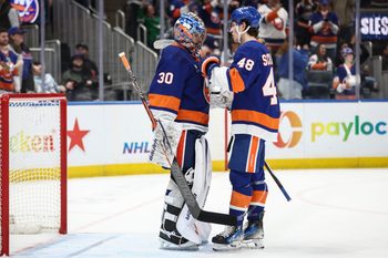 Mar 26, 2026; Elmont, New York, USA;  New York Islanders goaltender Ilya Sorokin (30) is greeted by defenseman Matthew Schaefer (48) after defeating the Dallas Stars at UBS Arena. Mandatory Credit: Wendell Cruz-Imagn Images