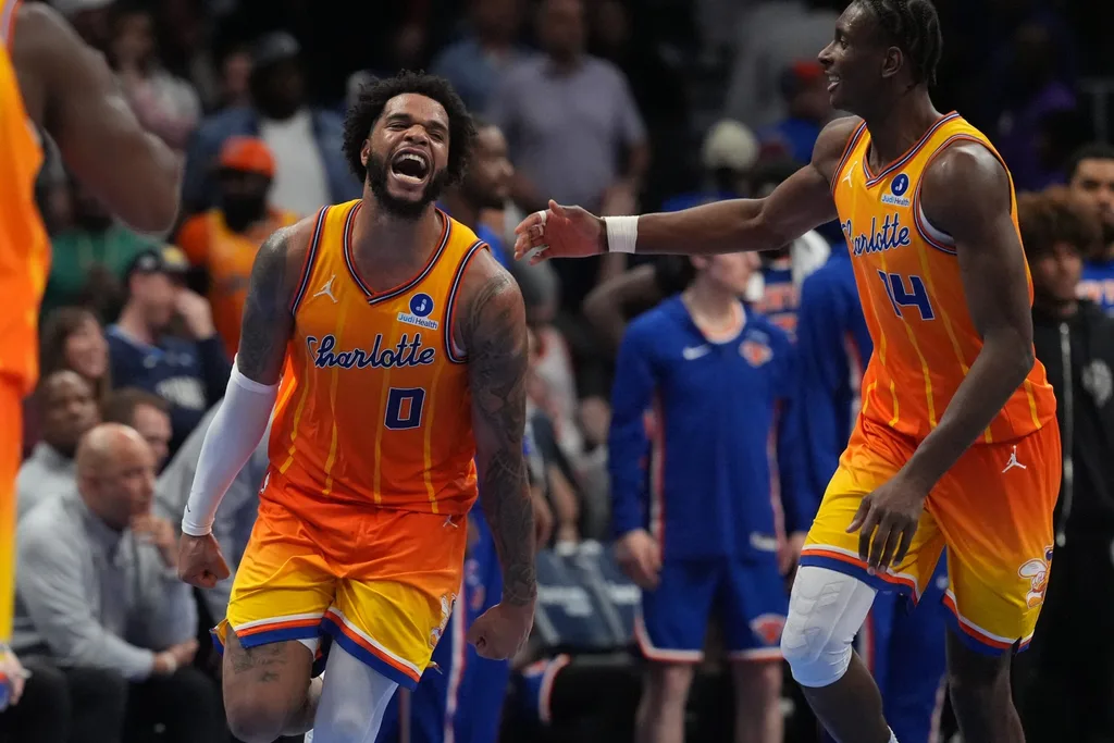 Mar 26, 2026; Charlotte, North Carolina, USA; Charlotte Hornets forward Miles Bridges (0) and forward Moussa Diabaté (14) react after a score against the New York Knicks during the second half at the Spectrum Center. Mandatory Credit: Jim Dedmon-Imagn Images
