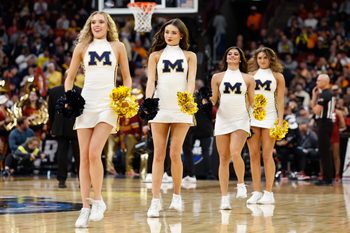 Mar 27, 2026; Chicago, IL, USA; Michigan Wolverines cheerleaders perform during the second half against the Alabama Crimson Tide during a Sweet Sixteen game of the Midwest Regional of the men's 2026 NCAA Tournament at United Center. Mandatory Credit: Kamil Krzaczynski-Imagn Images
