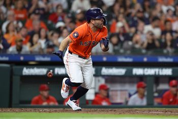 Mar 27, 2026; Houston, Texas, USA; Houston Astros second baseman Jose Altuve (27) hits an infield single during the fifth inning against the Los Angeles Angels at Daikin Park. Mandatory Credit: Troy Taormina-Imagn Images