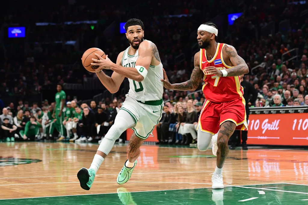 Mar 27, 2026; Boston, Massachusetts, USA; Boston Celtics forward Jayson Tatum (0) drives against Atlanta Hawks guard Nickeil Alexander-Walker (7) during the second half at TD Garden. Mandatory Credit: Bob DeChiara-Imagn Images