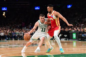 Mar 27, 2026; Boston, Massachusetts, USA; Boston Celtics guard Payton Pritchard (11) is defended by Atlanta Hawks guard CJ McCollum (3) during the second half at TD Garden. Mandatory Credit: Bob DeChiara-Imagn Images