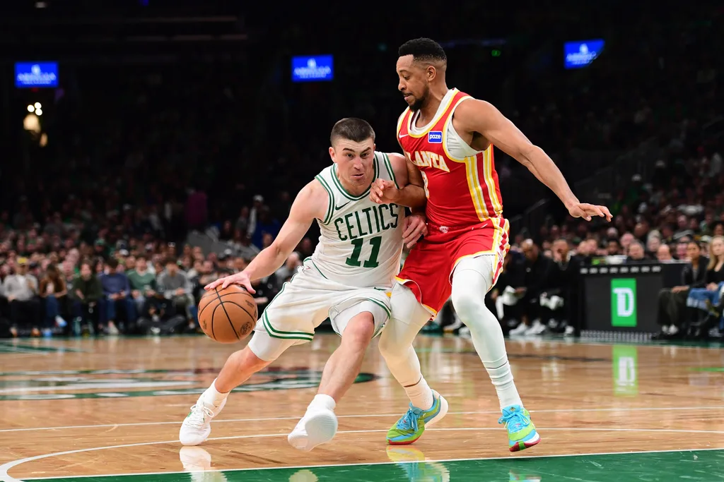 Mar 27, 2026; Boston, Massachusetts, USA; Boston Celtics guard Payton Pritchard (11) is defended by Atlanta Hawks guard CJ McCollum (3) during the second half at TD Garden. Mandatory Credit: Bob DeChiara-Imagn Images