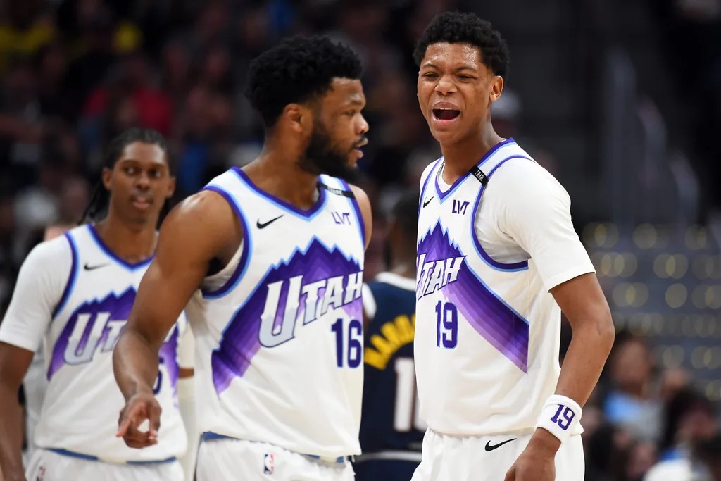 Mar 27, 2026; Denver, Colorado, USA; Utah Jazz guard Ace Bailey (19) celebrates with guard Elijah Harkless (16) during the second half against the Denver Nuggets at Ball Arena. Mandatory Credit: Christopher Hanewinckel-Imagn Images