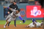 Mar 27, 2026; Los Angeles, California, USA; Los Angeles Dodgers right fielder Kyle Tucker (23) is safe stealing second base against Arizona Diamondbacks shortstop Geraldo Perdomo (2) in the eighth inning at Dodger Stadium. Mandatory Credit: Jayne Kamin-Oncea-Imagn Images