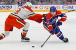 Mar 28, 2026; Edmonton, Alberta, CAN; Edmonton Oilersforward Matt Savoie (22) carries the puck around Anaheim Ducks defensemen Ian Moore (3) during the first period at Rogers Place. Mandatory Credit: Perry Nelson-Imagn Images