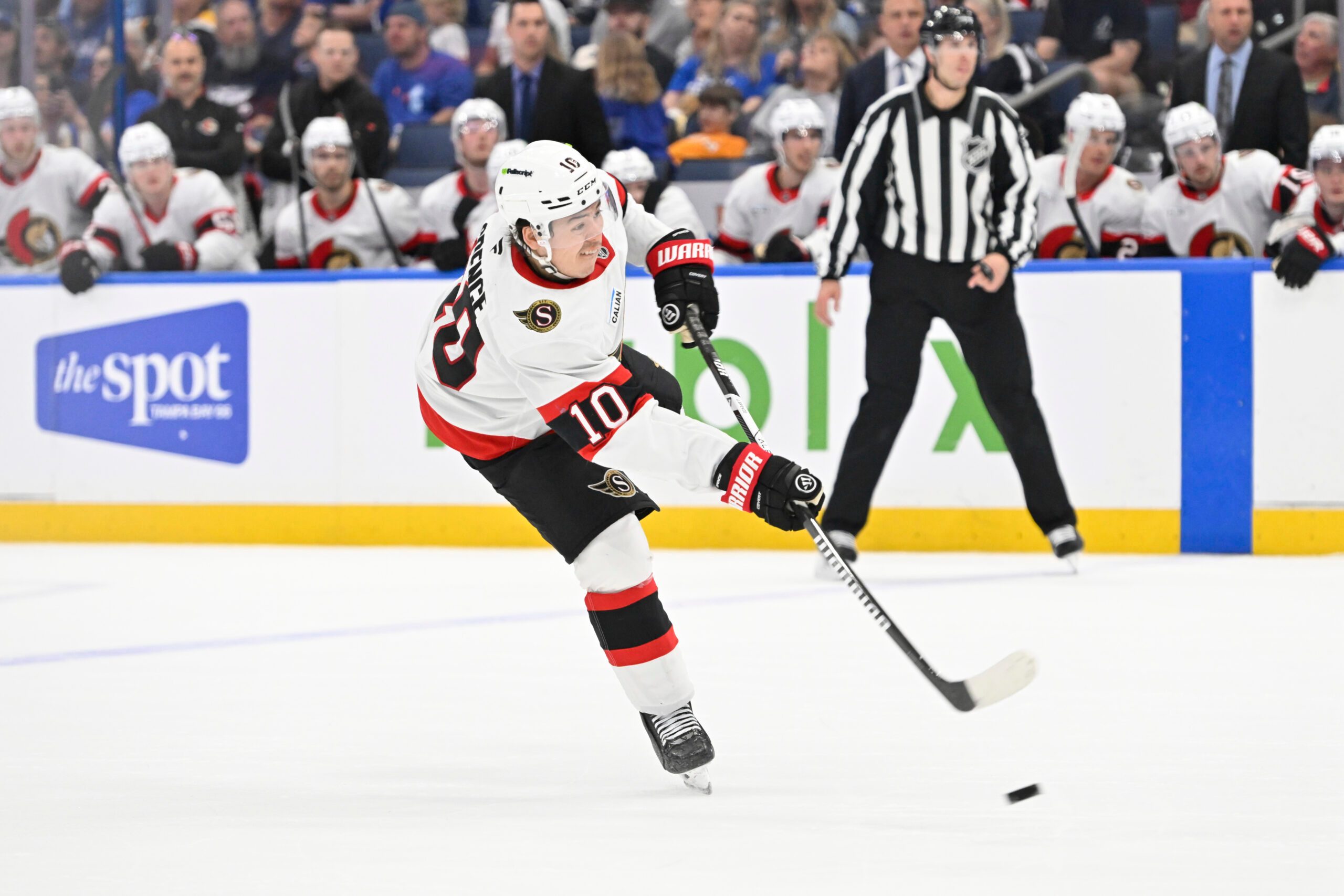 Mar 28, 2026; Tampa, Florida, USA; Ottawa Senators defenseman Jordan Spence (10) attempts a shot during the second period against Tampa Bay Lightning at Benchmark International Arena. Mandatory Credit: Pablo Robles-Imagn Images