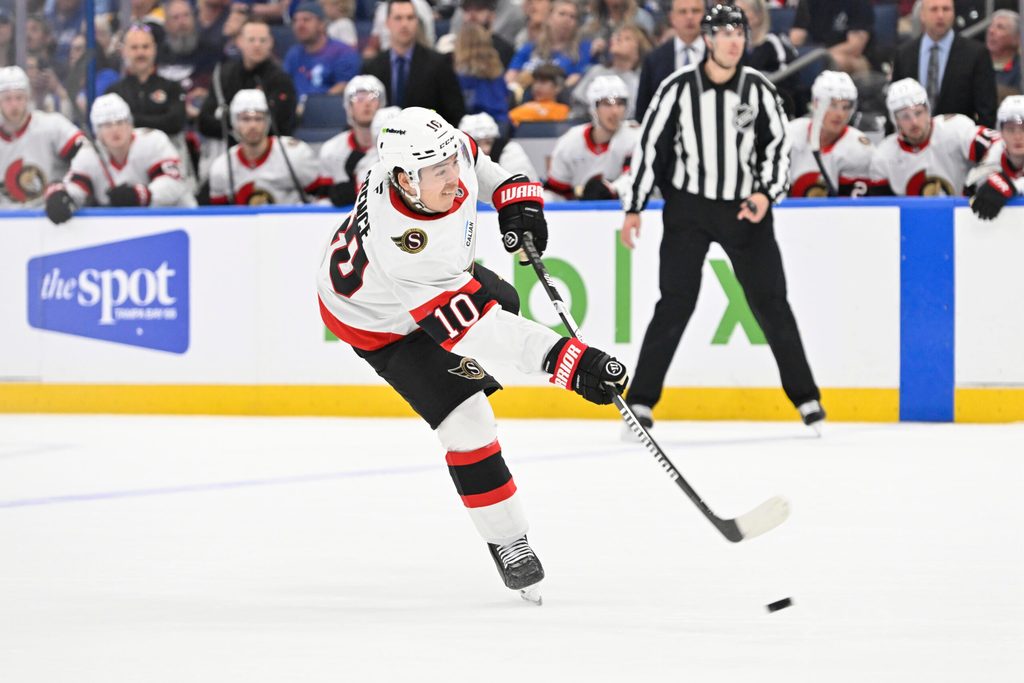 Mar 28, 2026; Tampa, Florida, USA; Ottawa Senators defenseman Jordan Spence (10) attempts a shot during the second period against Tampa Bay Lightning at Benchmark International Arena. Mandatory Credit: Pablo Robles-Imagn Images