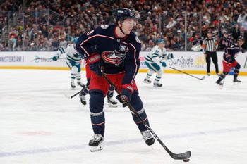 Mar 28, 2026; Columbus, Ohio, USA; Columbus Blue Jackets defenseman Zach Werenski (8) controls the puck against the San Jose Sharks during the first period at Nationwide Arena. Mandatory Credit: Russell LaBounty-Imagn Images