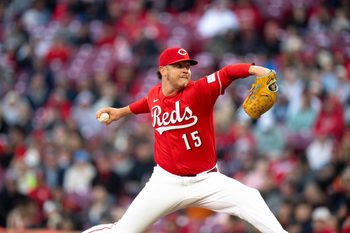 Cincinnati Reds pitcher Emilio Pagán (15) delivers the pitch in the eighth inning between the Cincinnati Reds and Boston Red Sox at Great American Ball Park in Cincinnati on Saturday, March 28, 2026.