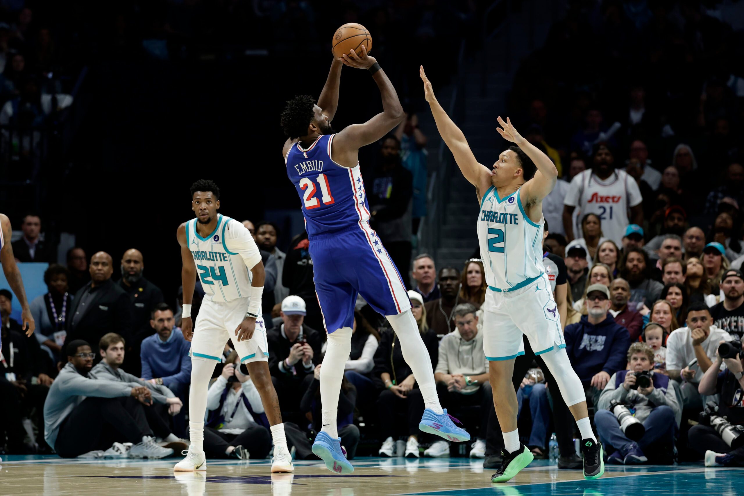 Mar 28, 2026; Charlotte, North Carolina, USA; Philadelphia 76ers center/forward Joel Embiid (21) shoots over Charlotte Hornets forward Grant Williams (2) during the fourth quarter at Spectrum Center. Mandatory Credit: Brian Westerholt-Imagn Images