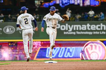 Mar 28, 2026; Milwaukee, Wisconsin, USA;  Milwaukee Brewers shortstop Joey Ortiz (3) and second baseman Brice Turang (2) celebrate after beating the Chicago White Sox at American Family Field. Mandatory Credit: Benny Sieu-Imagn Images