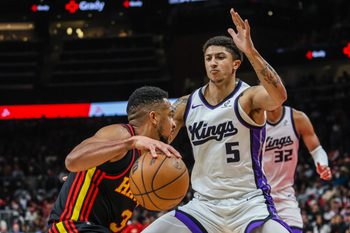 Mar 28, 2026; Atlanta, Georgia, USA; Atlanta Hawks guard CJ McCollum (3) drives the ball towards the basket against Sacramento Kings guard Nique Clifford (5) during the fourth quarter at State Farm Arena. Mandatory Credit: Jordan Godfree-Imagn Images