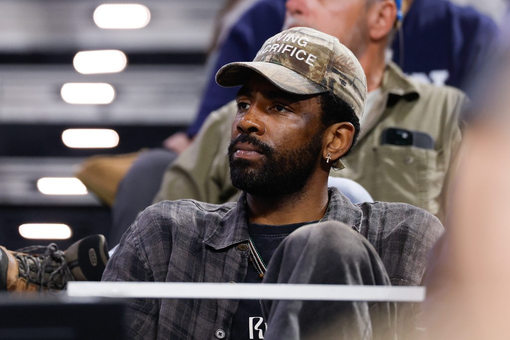 Mar 29, 2026; Fort Worth, TX, USA; Dallas Mavericks guard Kyrie Irving looks on from the stands during the second half of the game between the UConn Huskies and Notre Dame Fighting Irish at Dickies Arena. Mandatory Credit: Chris Jones-Imagn Images