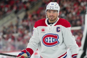 Mar 29, 2026; Raleigh, North Carolina, USA;  Montreal Canadiens center Nick Suzuki (14) reacts against the Carolina Hurricanes during the second period at Lenovo Center. Mandatory Credit: James Guillory-Imagn Images